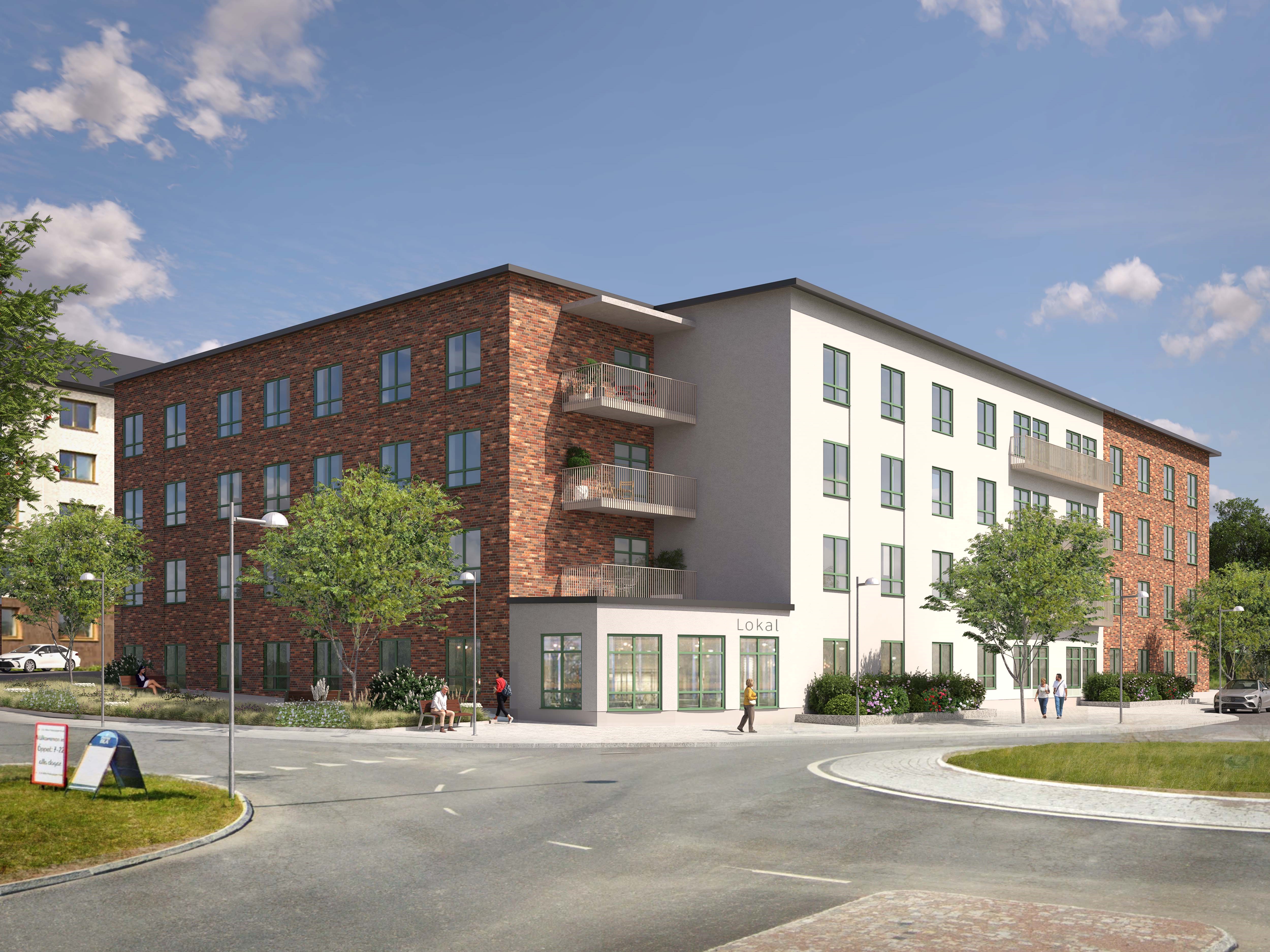 Fyravåningsbyggnad med fasad av både tegel och ljusa paneler, omgiven av träd och en väg